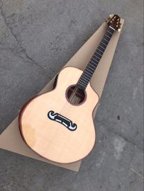 Chine La guitare en bois massif est faite à la main. Une guitare personnalisée unique. fournisseur