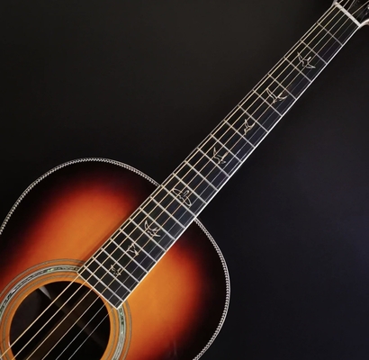 12-Fret Single 0 Shape Guitare faite à la main avec un joint de queue de pigeon Guitare acoustique solide KOA Dos fournisseur