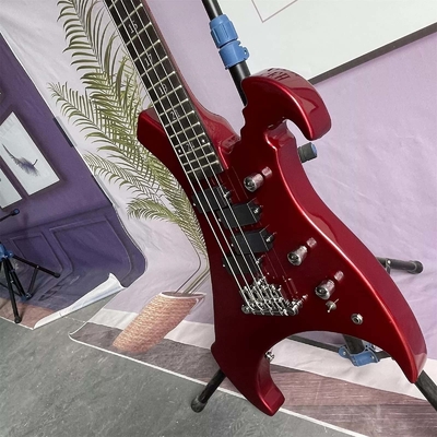 Guitare électrique à 4 cordes irrégulière en forme de corps spécial basse en métal rouge corps solide cou d'érable fournisseur