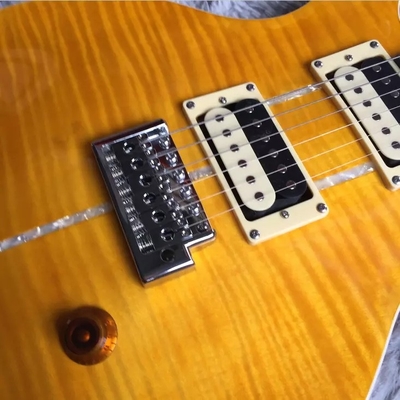 Guitare électrique personnalisée en flamme d'érable avec incrustation d'oiseau et matériel chromé en jaune PRS Santana Retro Orange fournisseur
